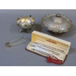 Three silver propelling pencils, a Peruvian ashtray, a 1920-1930s dish and cover, and a pair of