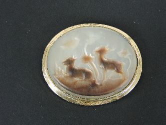 A carved mother of pearl shell cameo brooch, tested as approximately 14/15ct gold