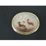 A carved mother of pearl shell cameo brooch, tested as approximately 14/15ct gold