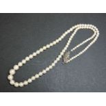 A single row graduated cultured pearl necklace, with a marcasite clasp