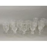 Seven facet cut wine goblets, 13.5cm high, three thistle shaped wine glasses, all raised on turned