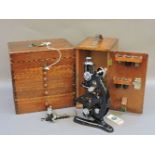 A dental cabinet with contents, and a cased microscope