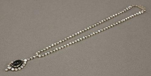 A silver, blue and white paste necklace, circa 1900, composed of a paste rivière, with each white