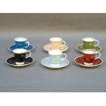 Six Susie Cooper coffee cups and saucers, of various colours