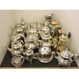A quantity of plated and brass wares, including entrée dishes, teapots, candlesticks, and a