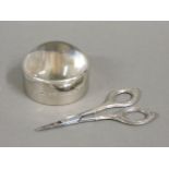 A silver mounted glass paperweight, 6.5cm diameter, Birmingham 2008, boxed, and a small pair of
