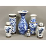 Six blue and white vases, comprising a pair of blue and white vases, painted with Buddhist lions