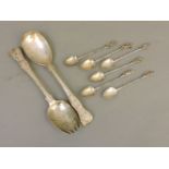 A pair of silver salad servers, London 1878, and six Continental apostle spoons, English silver