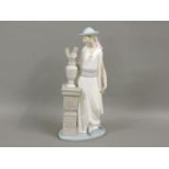 A Lladro figure, of a lady by a pedestal with a vase of flowers, 34cm
