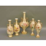 Two pairs and a single Royal Worcester blush ground vases, all decorated with floral bouquets, 22-