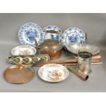 A box with copper hunting and coaching horns, horse brass strap, kettle, silver plated stand and