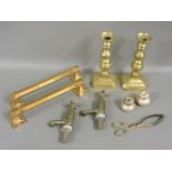 A pair of brass towel rails, 36cm long, a pair of Victorian brass candlesticks, 25cm high, a pair of