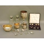 Silver, to include a trophy, christening cup, sugar bowl and cream jug, a pair of silver mounted