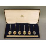 A cased set of six silver and silver gilt flower spoons, issued as 159/2000 by the Birmingham Mint