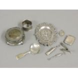 A small group of silver items, including a Continental pin tray, a dressing table box, and a white