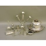 A collection of silver, seven napkin rings, a three vase centre piece, a small casket, the cover