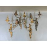 Two pairs of gilt metal electroliers, with flower sconces