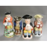 Four 19th century and later Staffordshire Toby jugs, two seated, a snuff taker, and one inscribed '