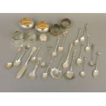 A box of silver, sterling silver and Continental novelty teaspoons, four napkin rings, a pair of