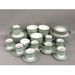 A Denby dinner service, in green, comprising eight large plates, eight dinner plates, six smaller