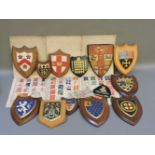 A box of assorted painted crest of arms, including the Royal College of Surgeons