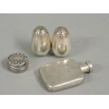A small silver flask, a pair of silver plated self righting pepperettes, and a small circular