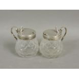 A pair of Victorian mustard pots, with silver covers and mounts and facet bodies, London 1849, 7.5cm