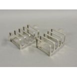 A matched pair of small silver toast racks, Birmingham 1948