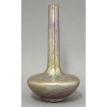 A Loetz-style iridescent glass vase,with a tall slender neck, with horizontal bands of yellow and