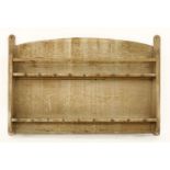 An Arts and Crafts oak plate rack,c.1915, designed by Sir Ambrose Heal for Heal's,107cm wide71cm