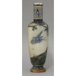 A Martin Brothers' stoneware vase,c.1880-90, incised with a crane flying amongst prunus and hills,