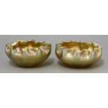 A pair of Tiffany favrile glass bowls,of plain form with crimped rims, etched 'L.C.T.',11.5cm