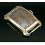 An Art Deco rose gold Bulova mechanical tank watch,with a curved rectangular rose gold case, a