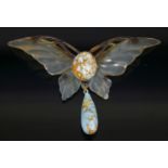 An Art Nouveau carved and stained horn butterfly pendant,possibly French, the carved horn