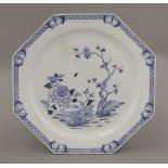 A blue and white octagonal large Plate,mid 18th century, painted in underglaze blue with a bird on