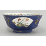 A famille verte powder blue Bowl, Kangxi (1662-1722), the exterior with birds and flowers in lobed