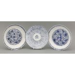 A pair of blue and white Dishes, Kangxi (1662-1722), each moulded with flutes and painted in the