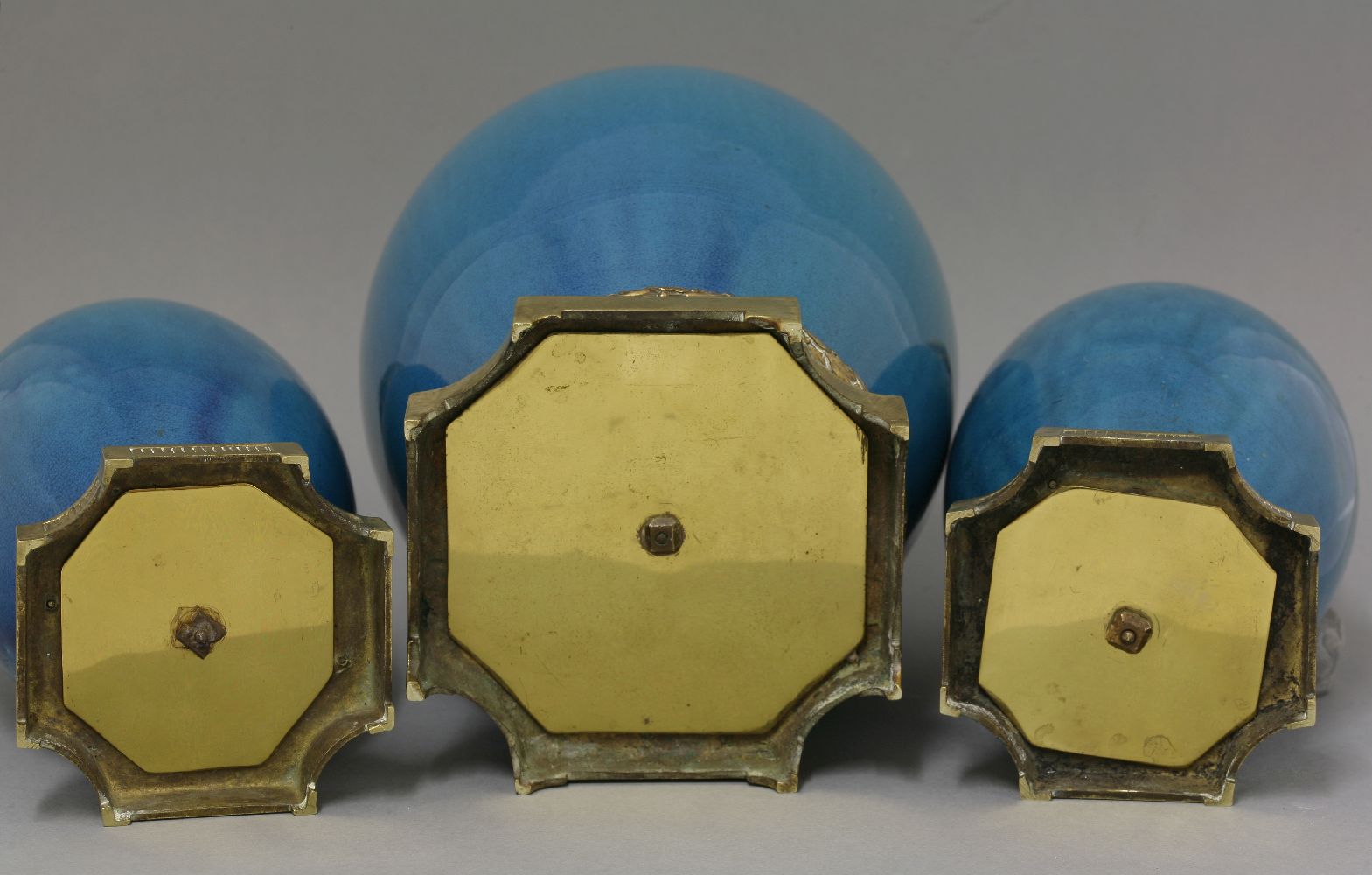 A garniture of three Vases, c.1900, the ovoid body under a turquoise glaze with gilt metal mounts, - Image 2 of 4