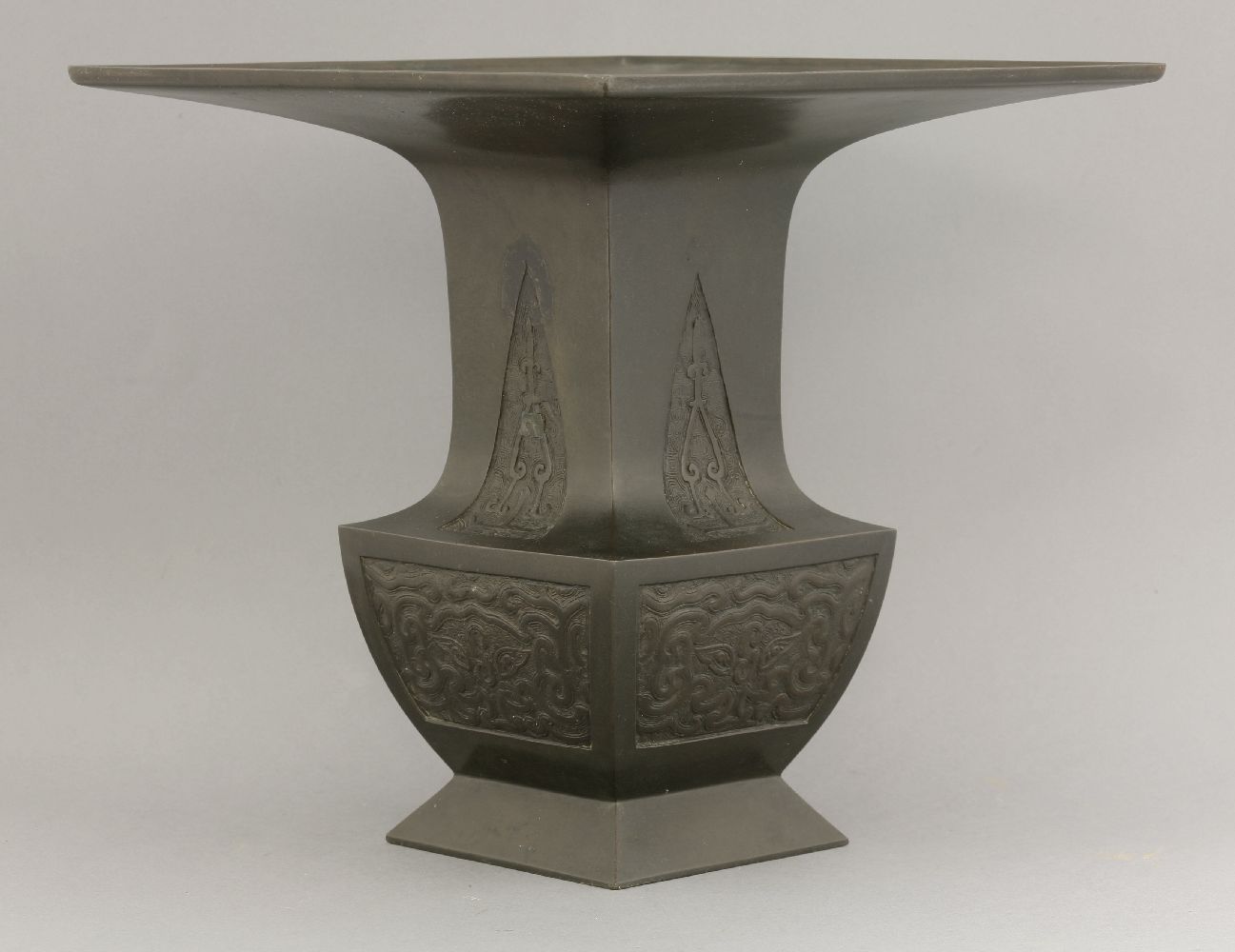 A bronze Ikebana Vase,c.1900, of square section, the neck with archaic blade panels above taotie, - Image 3 of 4