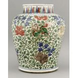 A wucai Vase,Chongzhen (1628-1644), enamelled overall with underglaze blue leaves and peonies