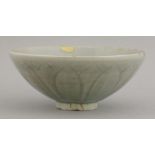 An attractive pale celadon Bowl,Southern Song (1127-1279), the exterior carved with lotus petals,