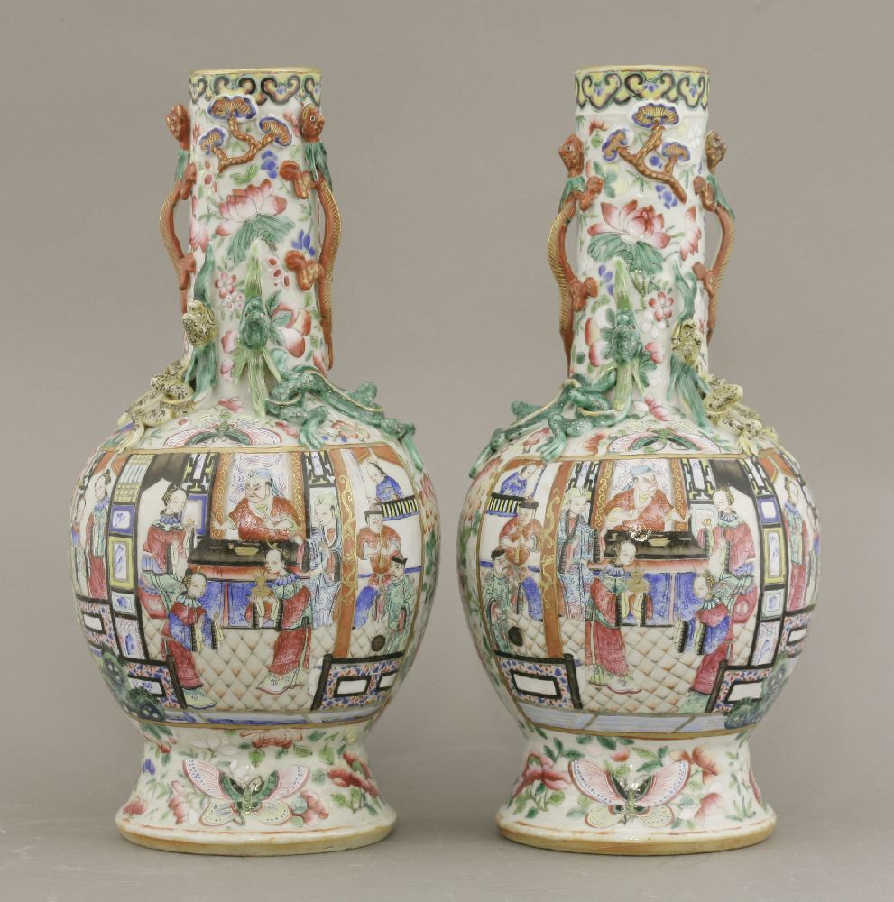 A pair of famille rose Vases,c.1880, typically enamelled with panels of a figure feasting with - Image 3 of 4