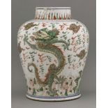 A baluster Jar,Chongzhen (1628-1644), boldly enamelled with a dragon rising from waves to a sky with