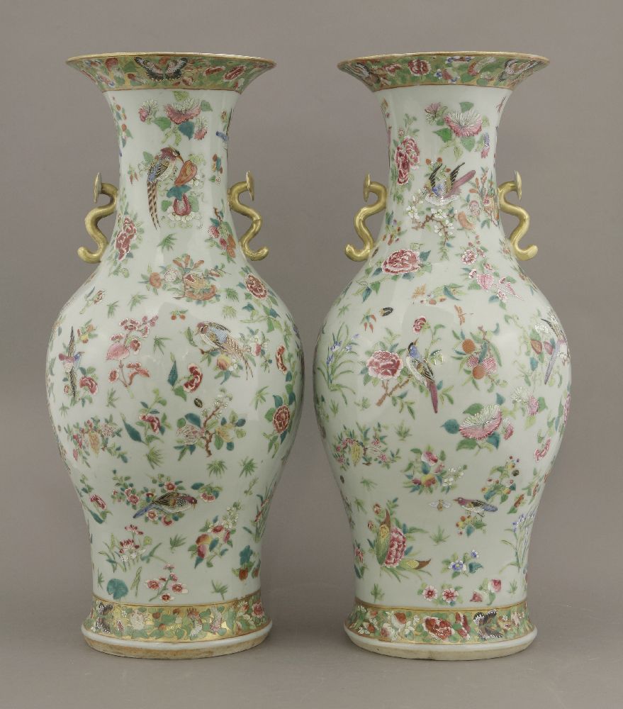 A pair of famille rose celadon ground Vases,c.1870, painted with pheasants amongst melons, Buddha'