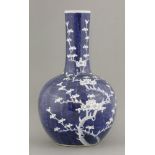 A large blue and white Bottle Vase,mid 19th century, painted with 'waves' leaving white branching