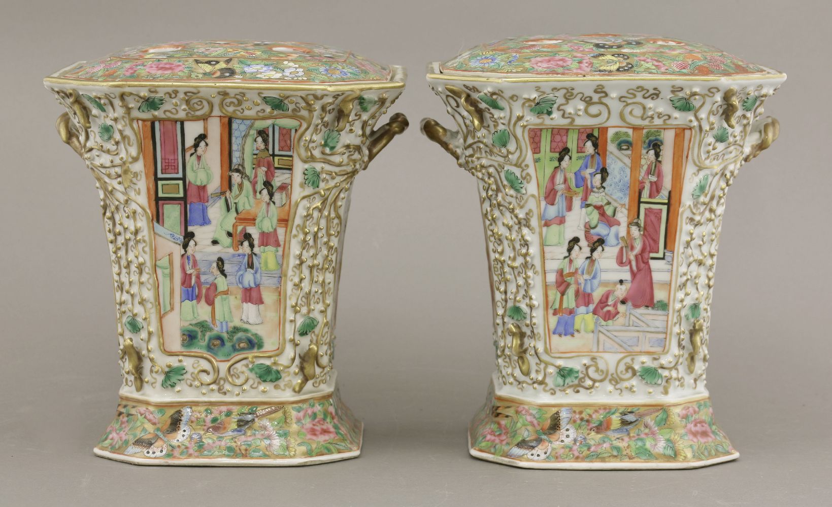 A pair of Canton enamel Bough Pots and Covers,c.1860, the panels of figures in interiors and in a