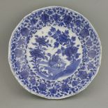 An attractive Dish,Kangxi (1662-1722), the centre painted in bright underglaze blue with two birds
