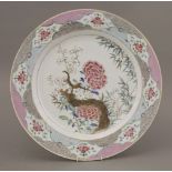 A large famille rose Dish,Yongzheng (1723-1735), boldly enamelled with peony and flowering prunus