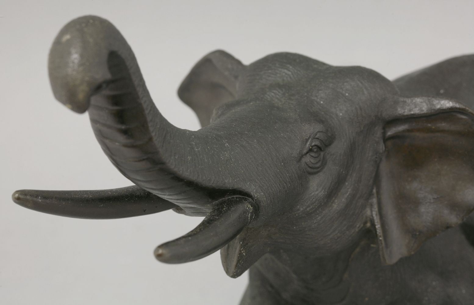 A bronze Elephant,c.1880, striding forward with trunk upraised and with typical rough skin, cast - Image 3 of 4
