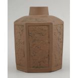 A rare Yixing Tea Canister,c.1700, the hexagonal body moulded with panels of growing shrubs and